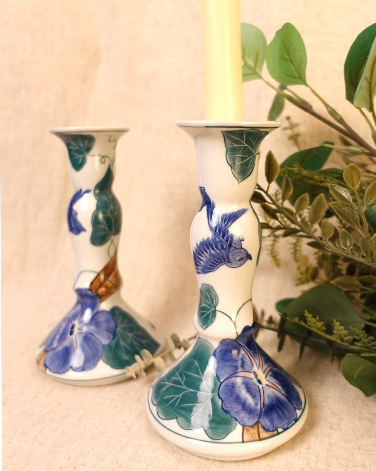 A pair of ceramic vintage candlesticks